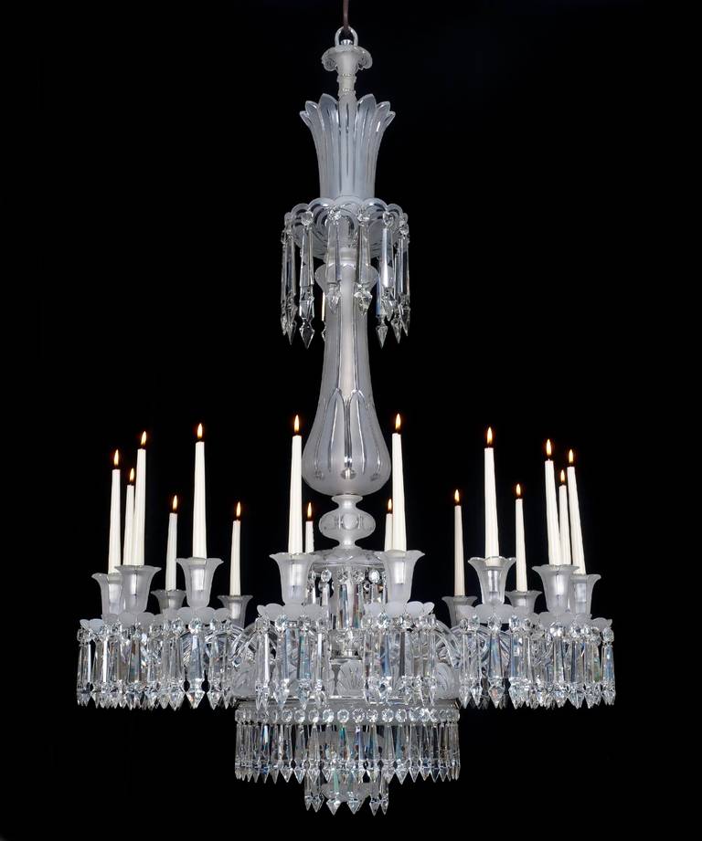 A fine quality mid-Victorian cut-glass silvered mounted sixteen-light chandelier the baluster stem with drop hung top canopy, terminating with petal edged frosted glass crown, the main frame surmounted by frosted glass shells, separated by sixteen