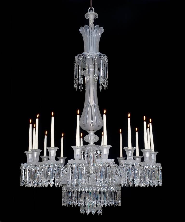 A fine quality mid-Victorian cut-glass silvered mounted sixteen-light chandelier the baluster stem with drop hung top canopy, terminating with petal edged frosted glass crown, the main frame surmounted by frosted glass shells, separated by sixteen