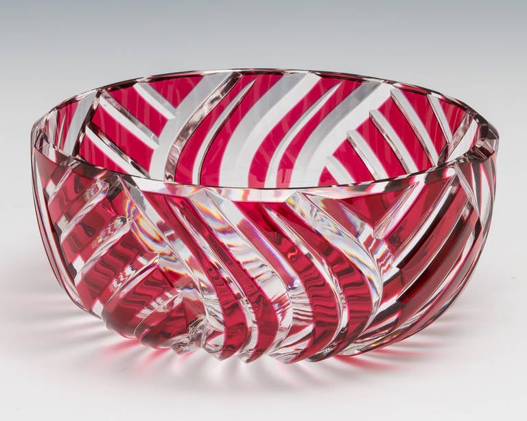 A fine cut crystal bowl by Val St Lambert with deep miter swirl cuts and ruby red flashing. Signed underneath.