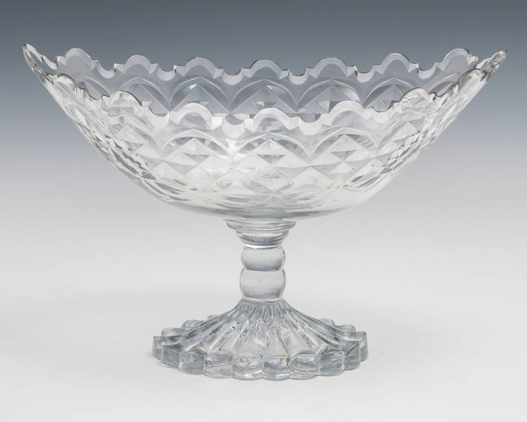 A fine Georgian diamond and flat cut bowl with van dyke rim on double knopped pressed moulded foot.