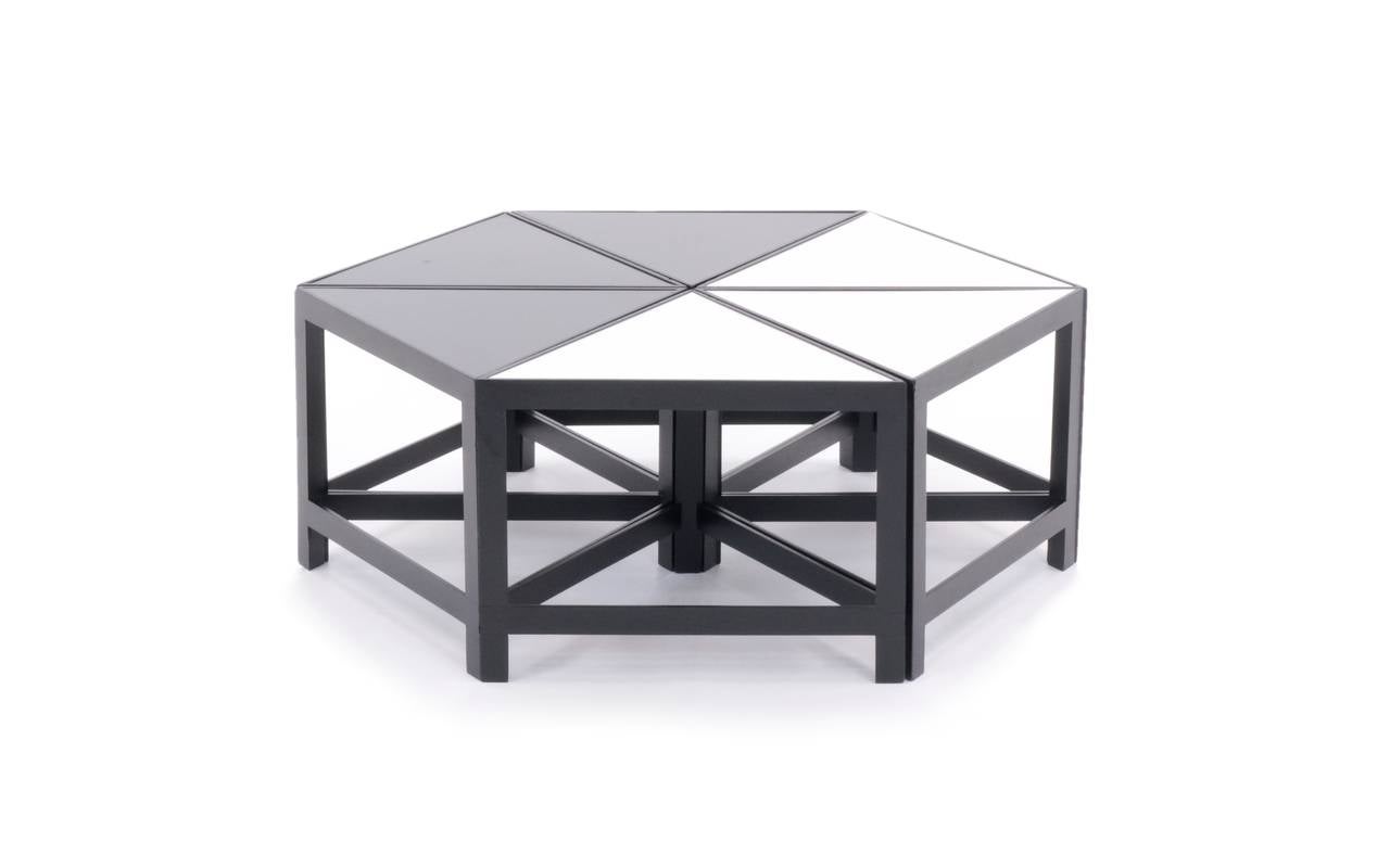 Great set of six multifunctional triangular tables. White and black laminate tops. Lacquered wood frames.
Individual tables.
 Width - 21.75 in.
 Depth - 18 in.
 Height - 15.5 in.