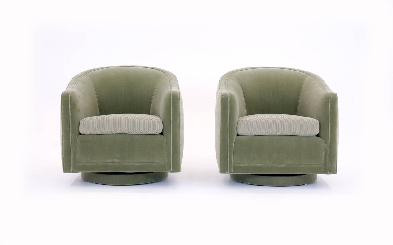 Beautifully reupholstered swivel chairs designed by Edward Wormley for Dunbar. The chairs have a memory swivel mechanism in that when the chair is unoccupied it returns to the direction it was initially facing.