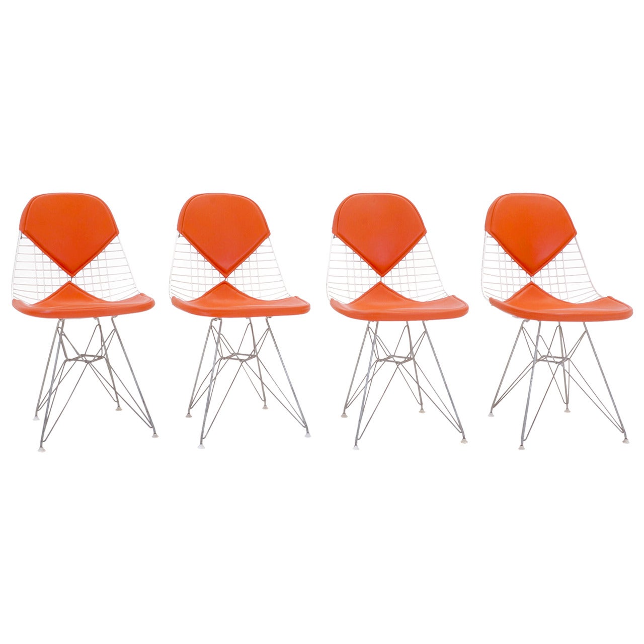 Four Eames Herman Miller DKR Wire Chairs on Eiffel Bases & Orange Girard Vinyl