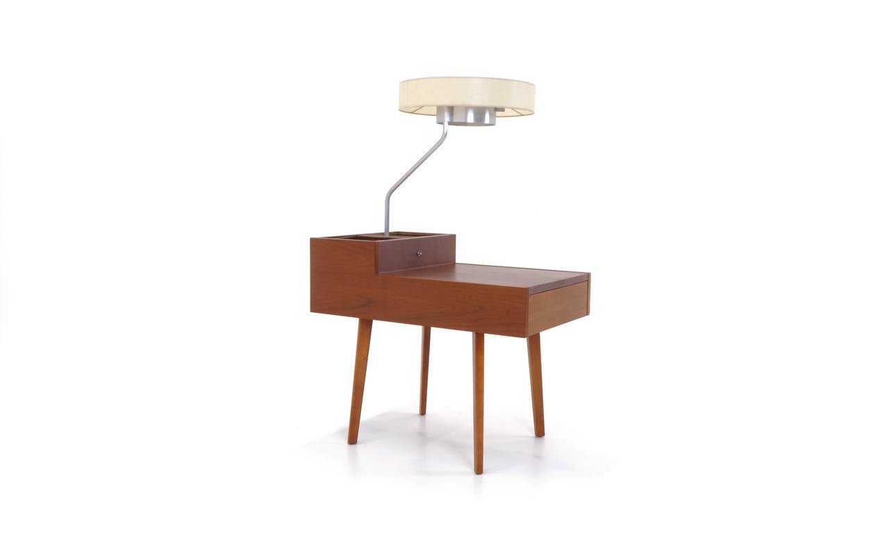 Original George Nelson for Herman Miller side table with lamp. Leather table top and brass planters with a copper top edge. Original shade in excellent condition. An excellent example.