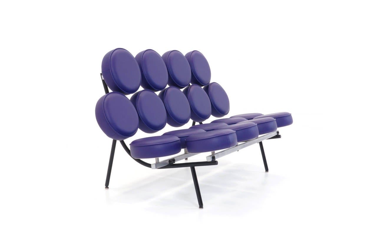 George Nelson for Herman Miller Marshmallow Sofa.  Purple vinyl.  These are often confused with leather.  Virtually impossible to tell from leather without a leather one next to it.  Most of these out there are vinyl as is this one.  We also have