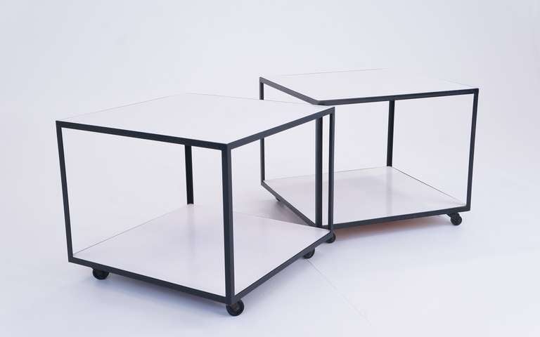 Pair of Nelson Steel Frame Tables on the original working casters.  These can also be used as a serving cart.  All original black lacquered steel frames and white laminate tops.  One table retains the early foil label.