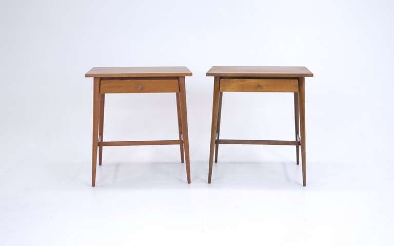 Pair of Paul McCobb for Calvin Night Stands.  These would also make nice living room end tables.  Subtle contours in the drawers and legs.  Original brass pulls.