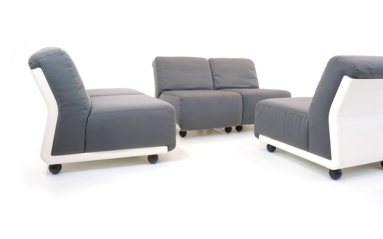 Six modular / sectional Amanta seating units for C & B Italia. They are currently attached in pairs, but can be detached or attached in any manner. Grey upholstery with white fiberglass frames. Very comfortable. Each individual piece is 24