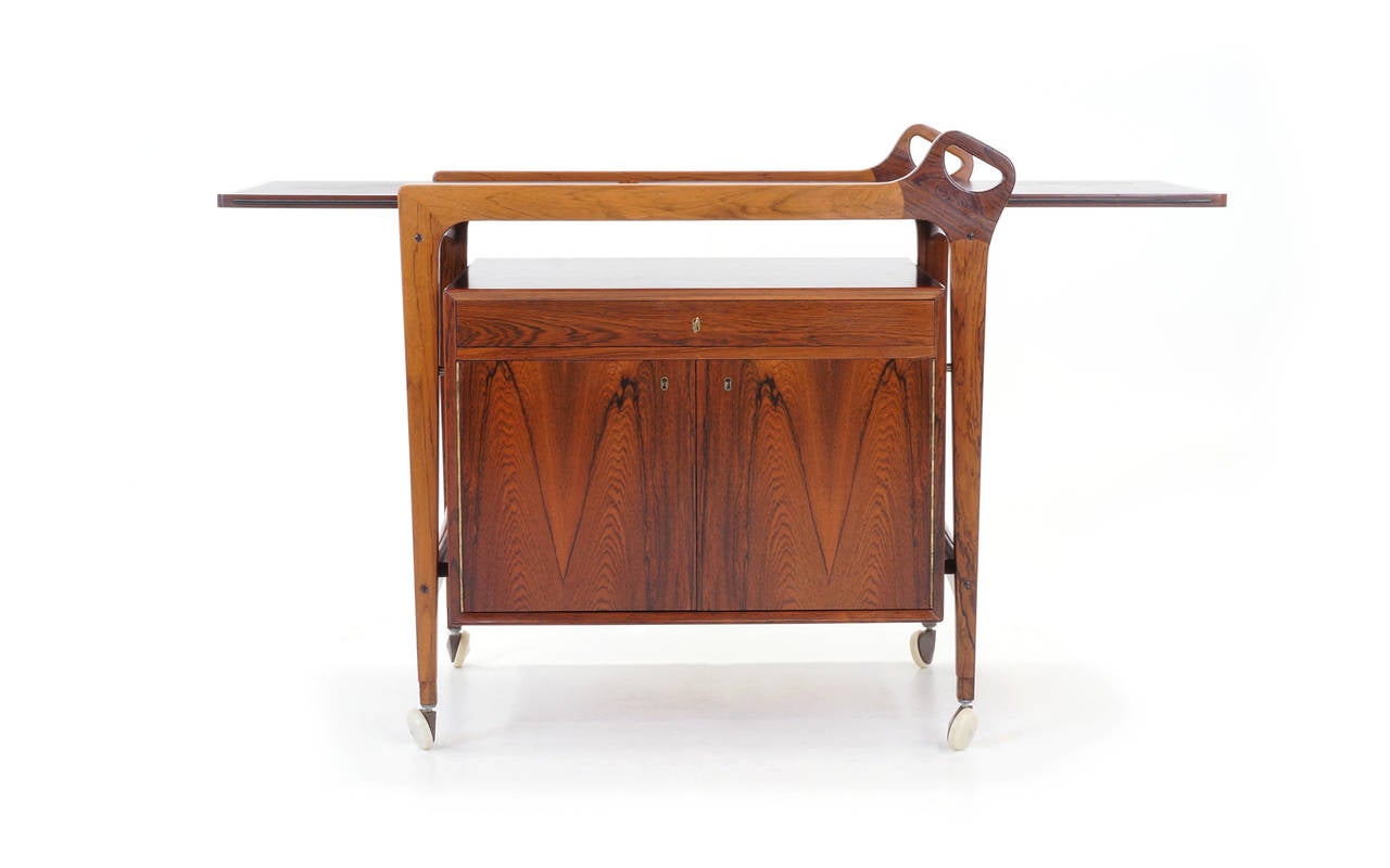 Scandinavian Modern Danish Rosewood Bar Cart by Arne Vodder. Leather expandable drop leaf top.