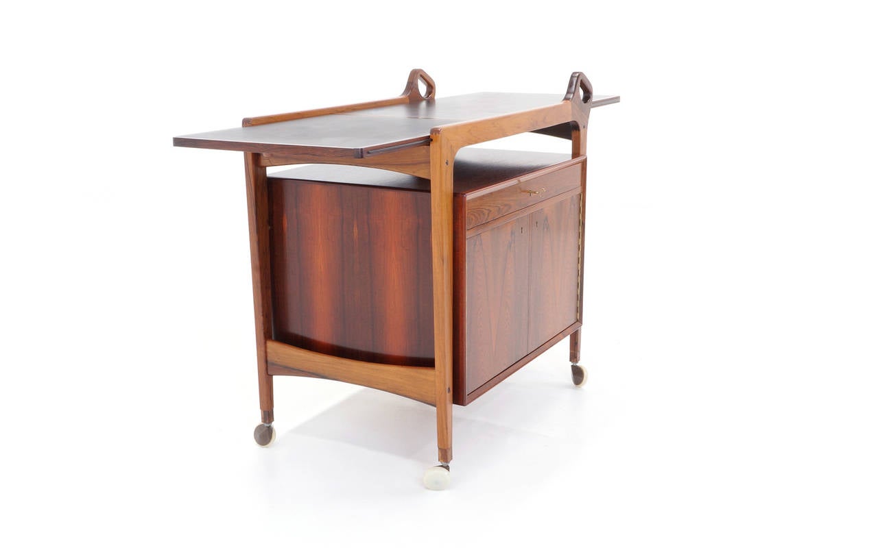 Danish Rosewood Bar Cart by Arne Vodder. Leather expandable drop leaf top. In Excellent Condition In Kansas City, MO