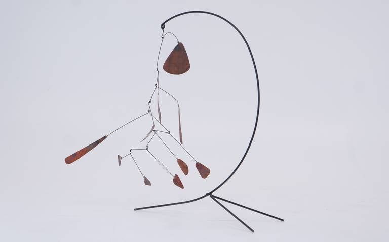 Vintage table top mobile in the style of Alexander Calder.  We have been unable to determine a designer or maker, but this is a beautiful vintage object.