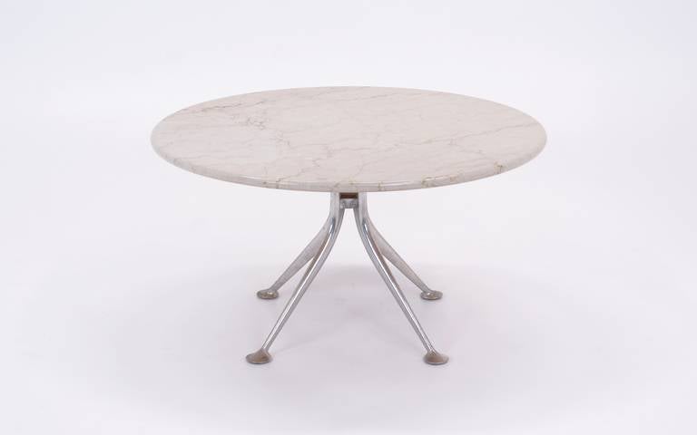 Made by Herman Miller for only two years in the mid-1960s, Alexander Gorards furniture designs are very rare and have become increasingly sought after.  This coffee table with the cast aluminum base and Italian marble top connected by rubber