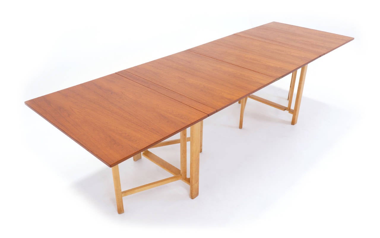 From 9 inches to over 9 feet, this is the original, signed Bruno Mathsson Maria gate leg dining table. Teak.