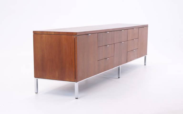 Very high quality construction, beautifully figured walnut credenza.  Finished on both sides.  Chromed steel frame base with polished aluminum pulls.  Quality of construction and design on a par with Florence Knoll for Knoll, but at 1/2 the price.