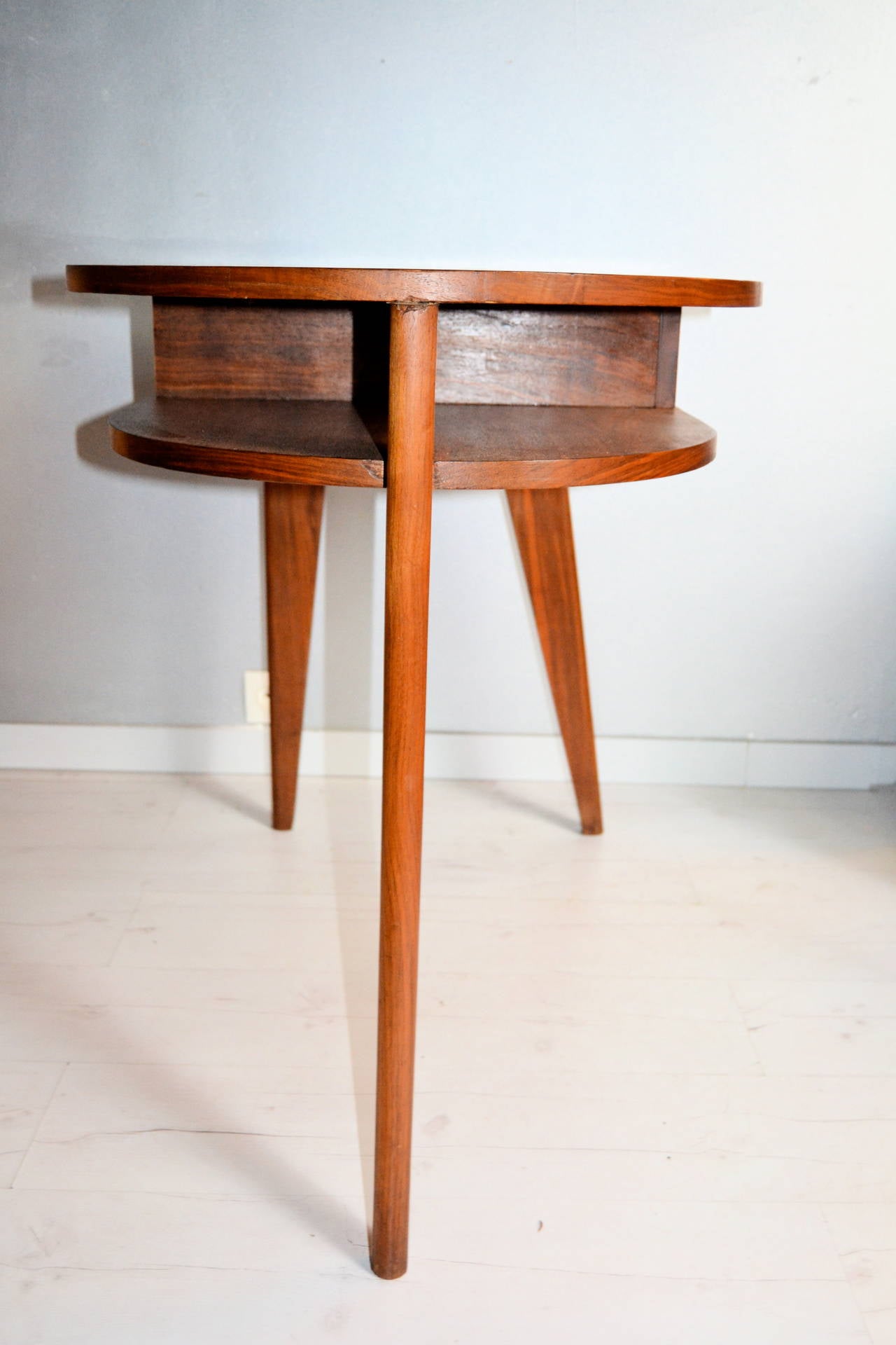 Late 1940s wood Jacques Adnet Desk with three legs design. Marqueterie top
one-drawer.