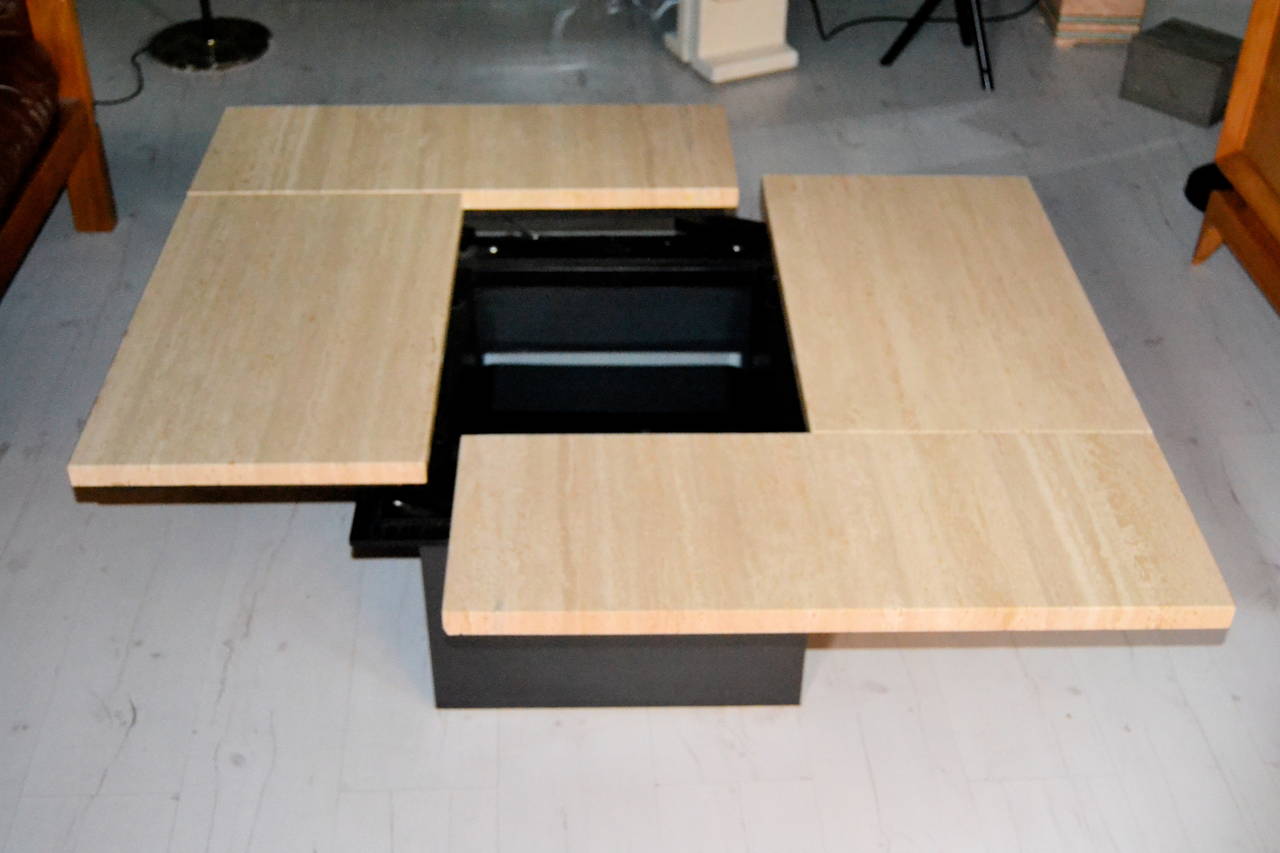 1970s travertine top sliding coffee table with mirrored interior bar. The bar is composed of two Lucite some thick elements.
Table can be closed and open with a sliding system. This table was selling it in late 1970s at Jansen shop in Paris.
Table