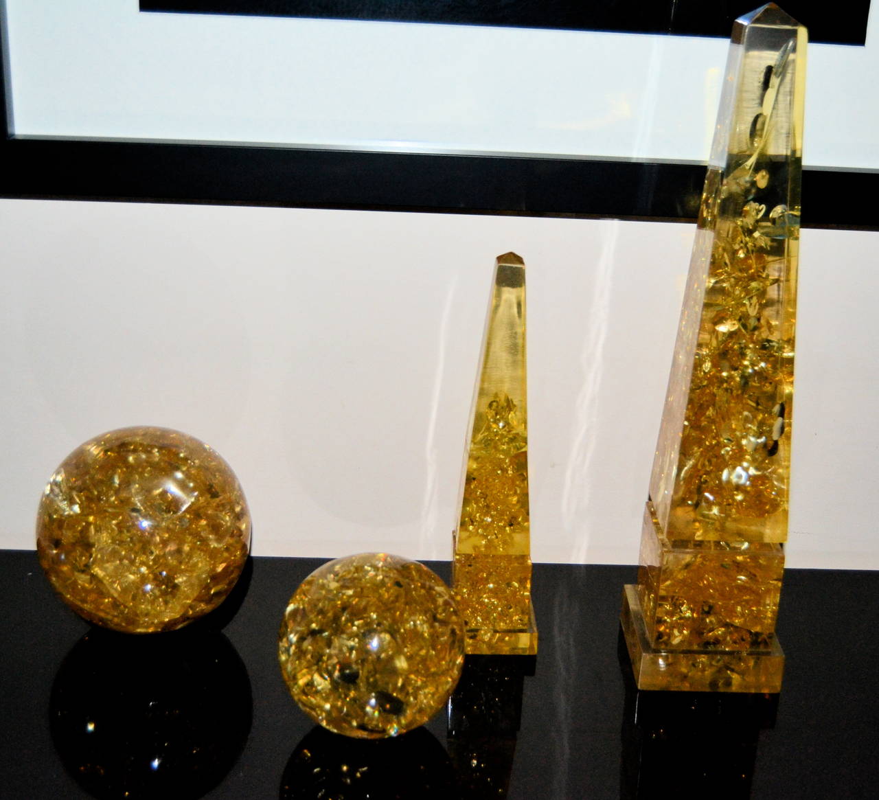 Set of 1970s resin objects composed by two spheres and two obelisk created by Marie-Claude de Fouquieres. Great condition and elegant pieces for decorate.

Big obelisK: 54cm x 12cm x 12cm.
Mid obelisk: 33cm x 8cm x 8cm.
Big sphere: 20cm.
Mid