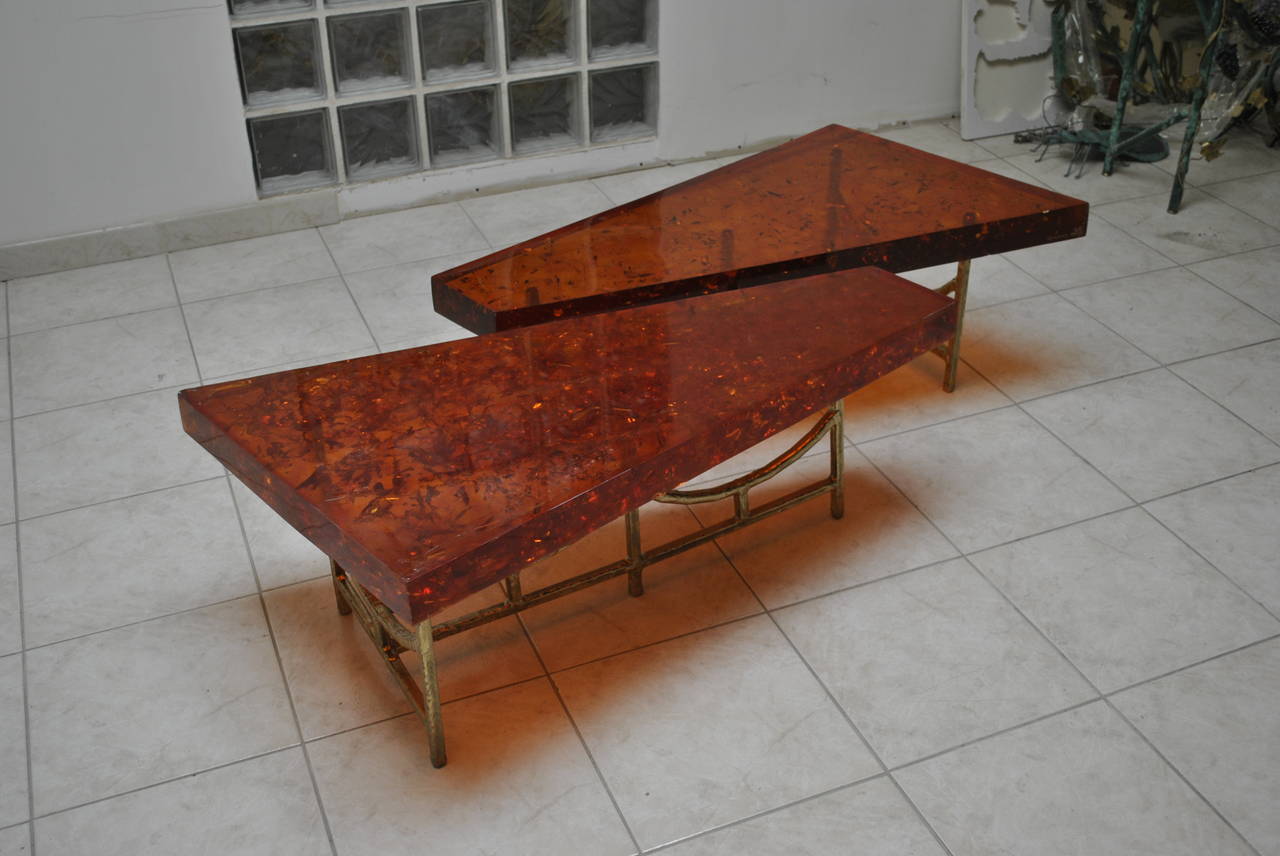Unique and spectacular double brass and resin coffee table made by Henri Fernandez in 1972. Very good condition, signed and dated.
Dimensions on the bottom are for one element. Can be placed together as a large coffee table or presented separately