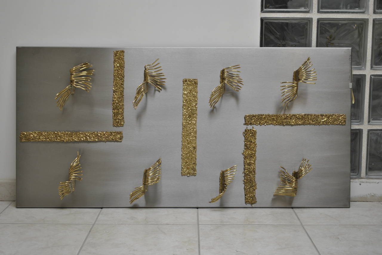 A very nice steel and brass wall sculpture entitled 