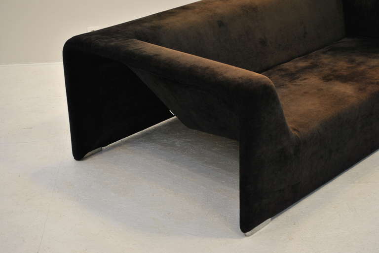 A truly beautiful and rare sofa by the house of Zanotta. Probably from the 1980s. Shades of deep chocolate brown velvet (the color goes from chocolate to almost black if you look in different angles). 
The sofa is marked Zanotta and has still its