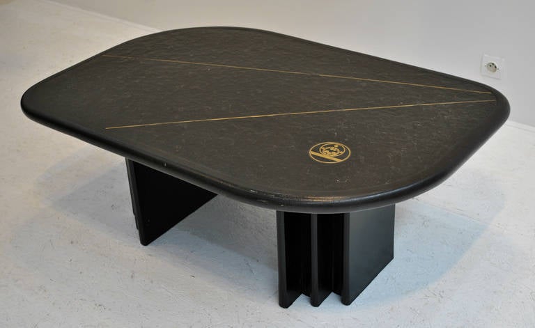 A nice slate and bronze inlay Kingma style coffee table. Nice wooden table base.

FREE SHIPPING to Continental Europe, UK, Canada and USA is offered for this item if bought directly through 1Stdibs. (White glove for smaller pièces and shipping to