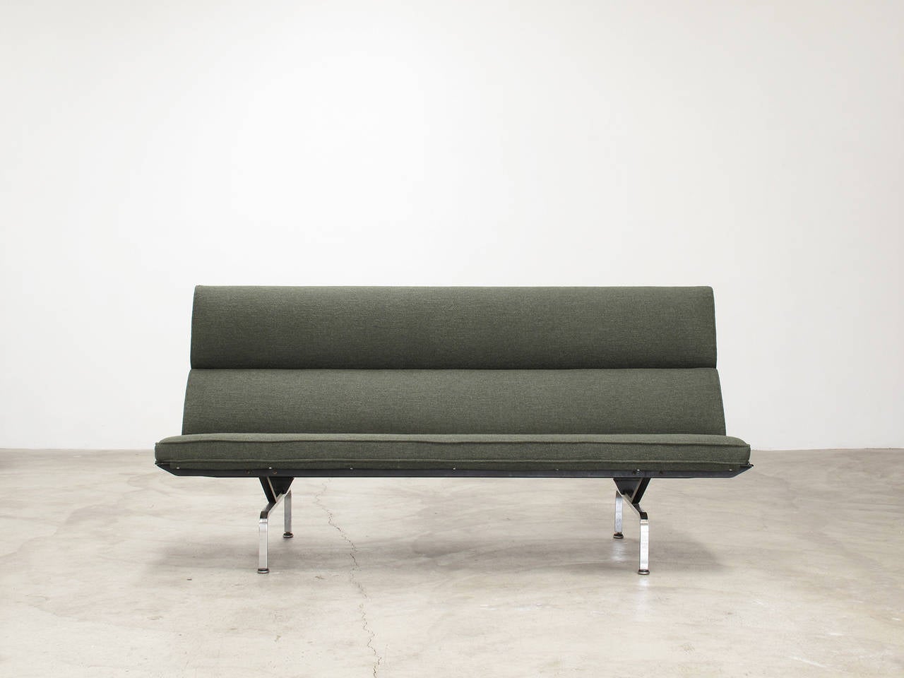 Sofa Compact designed by Charles and Ray Eames for Herman Miller, mid to late 1960s production.

Signed with applied metal manufacturer's label to underside: Charles Eames Design Herman Miller Zeeland Michigan. All four legs retain the original