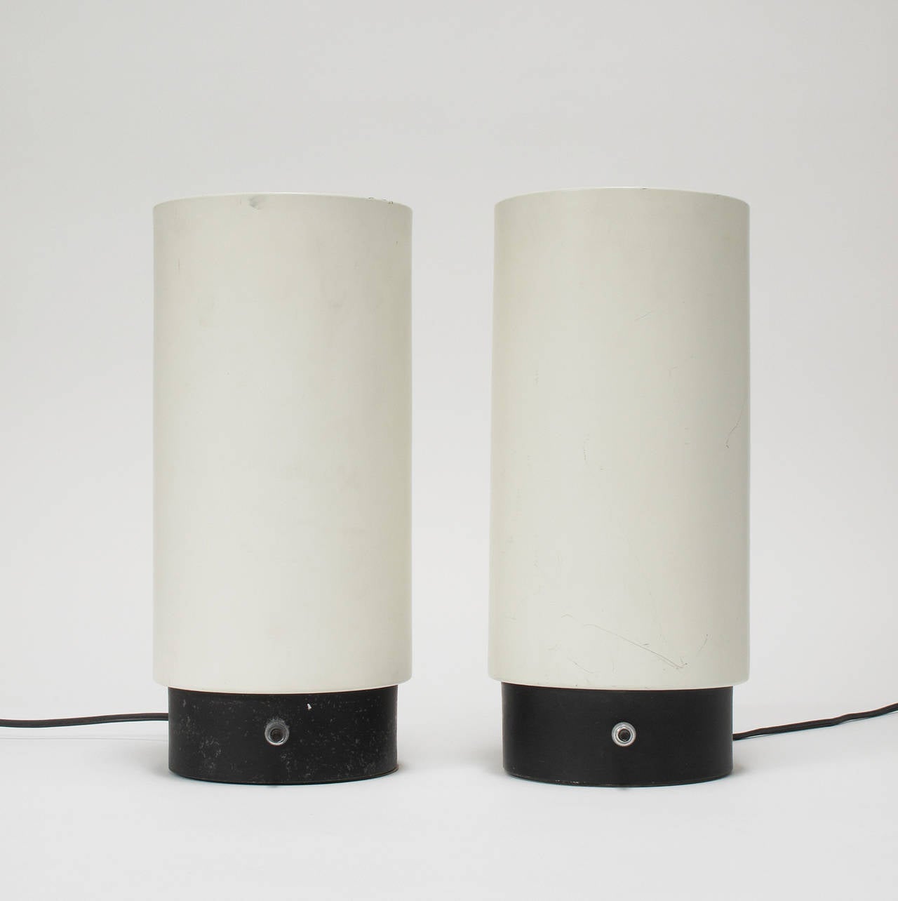 Pair of black and white canister lamps with one Directional spot designed by Gerald Thurston, Lightolier, New York, late 1960s production, both lamps retain "Lightolier" label affixed to bottom of interior.