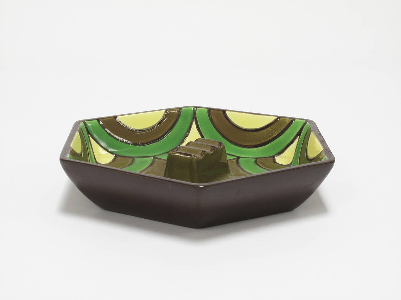 Colorful hand decorated, glazed ceramic dish, part of the contemporary collection designed exclusively for Haeger by Ben Seibel, celebrating "the look of today with youth appeal." An exclusive import, marked on bottom "Haeger,"