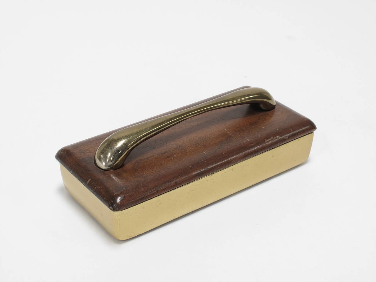 Designed by Ben Seibel and made by Jenfred Ware, New York, 1950s. Brass-plated, cork lined metal box with two storage compartments, wood lid and brass handle. Small keepsake container for trinkets, jewelry and precious objects.