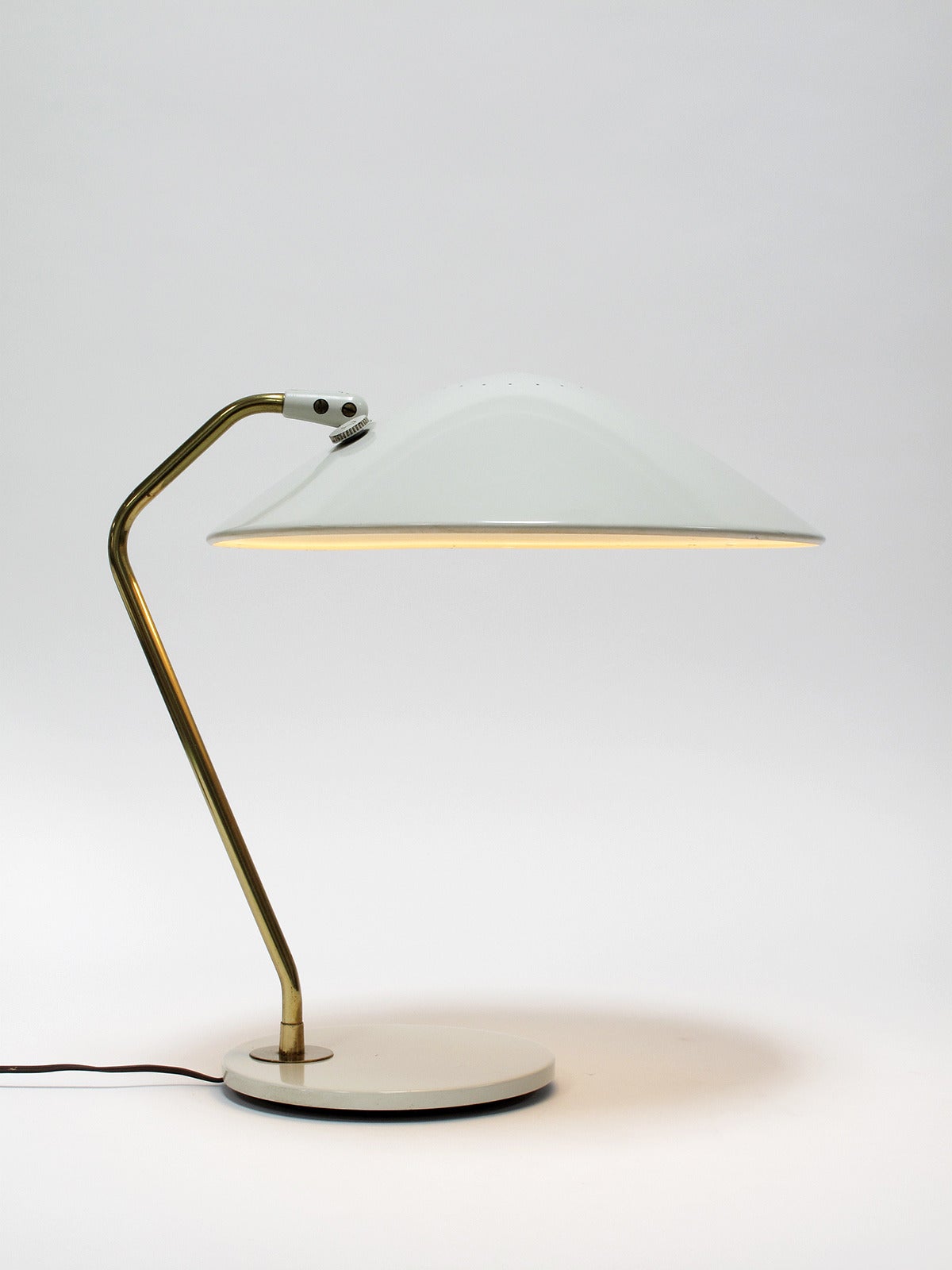 Table lamp with enameled aluminum shade perched atop an elegant brass stem and white base, designed by Gerald Thurston and made by Lightolier, New York, 1960s