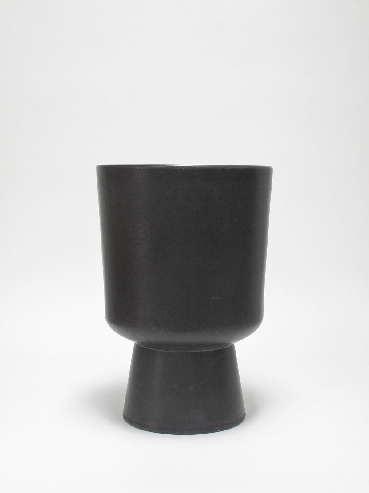 Collection of vintage AP vessels in three storied designs

L-20 planter in black glaze by Malcolm Leland
CP-13 in ochre glaze by John Follis
M-1 planter in white glaze by Paul McCobb
Architectural Pottery, Los Angeles
California Modern,
