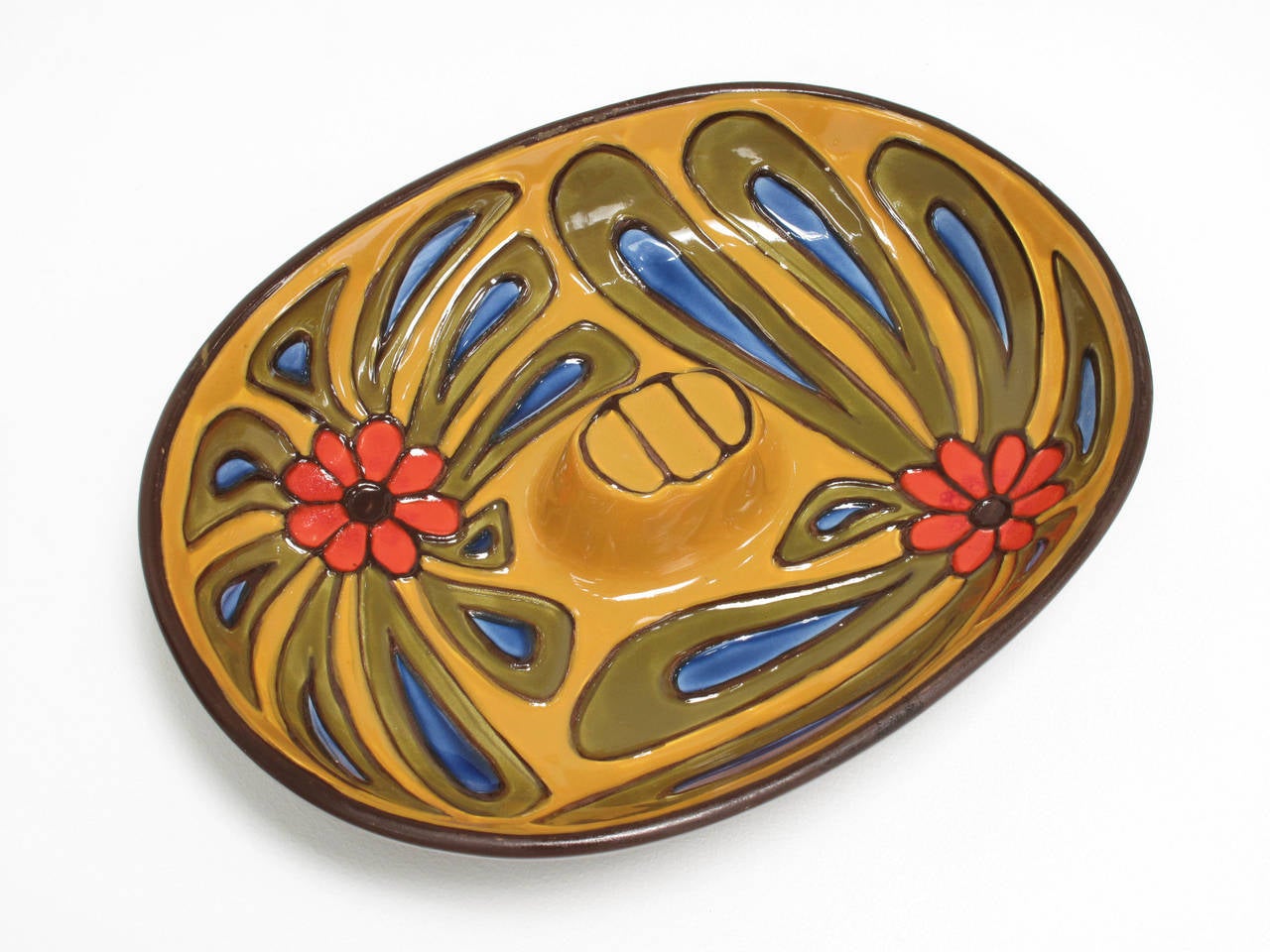 Colorful hand decorated, glazed ceramic dish, part of the contemporary collection designed exclusively for Haeger by Ben Seibel, celebrating "the look of today with youth appeal." An exclusive import, marked on bottom "Haeger,"