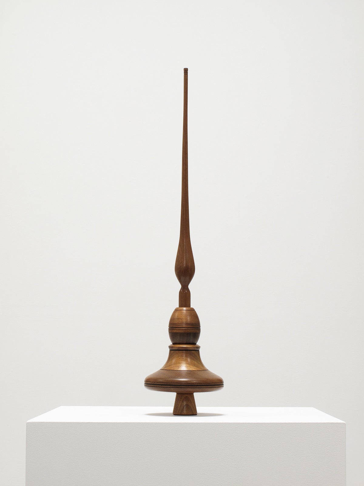 Richard Patterson
Sculpture, 1978
Unique, decorative object and enjoyable spinning top toy
Solid woods: Iroko, Thailand rosewood and black walnut
Hand-turned on a lathe in his California studio

Measurements in inches: 24 1/4 high x 5 1/4
