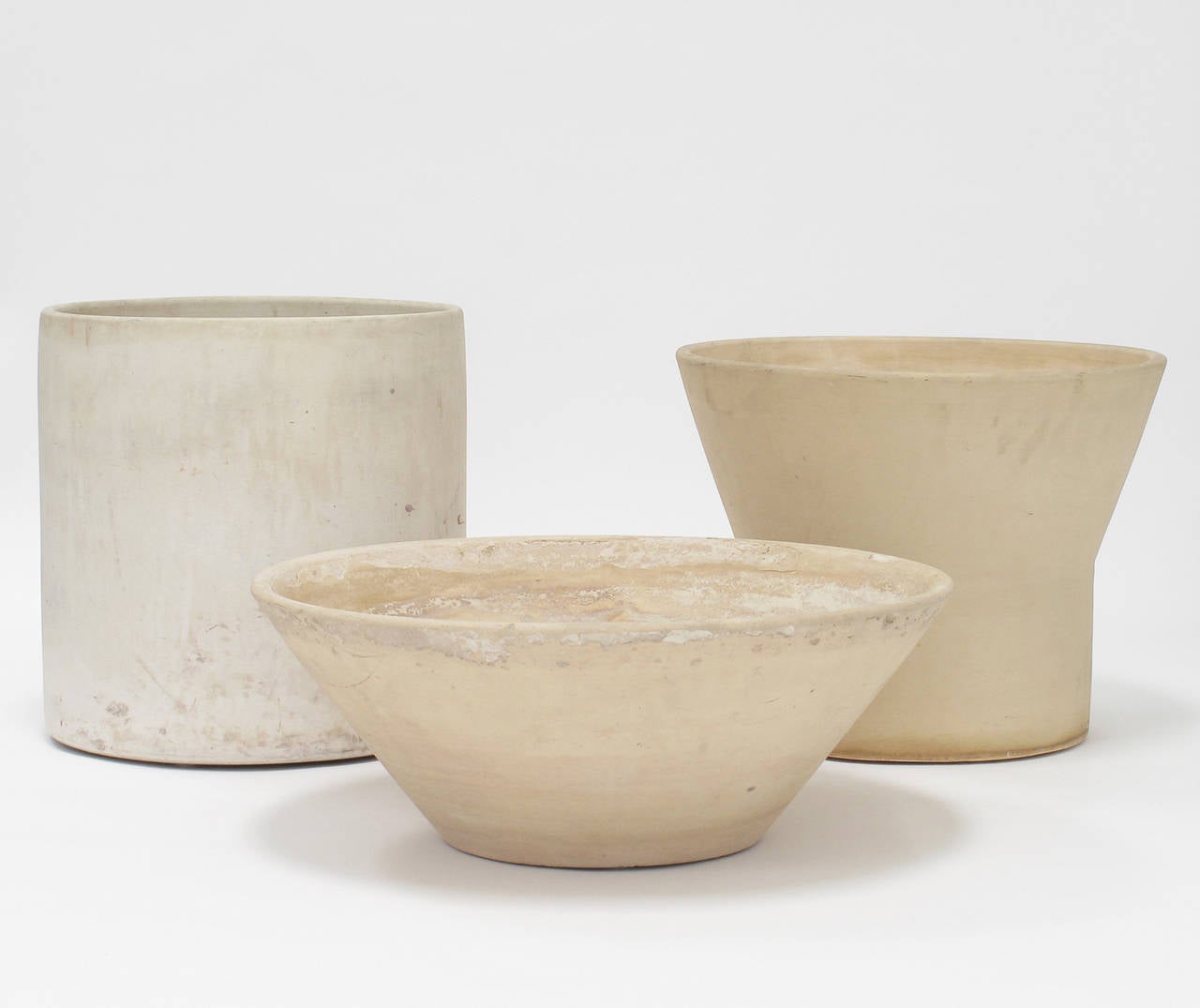 Collection of vintage AP including three bisque planters designed by Paul McCobb, John Follis and LaGardo Tackett, Architectural Pottery, Los Angeles, California, 1950s, all displaying a California modern, indoor-outdoor patina.

Dimensions