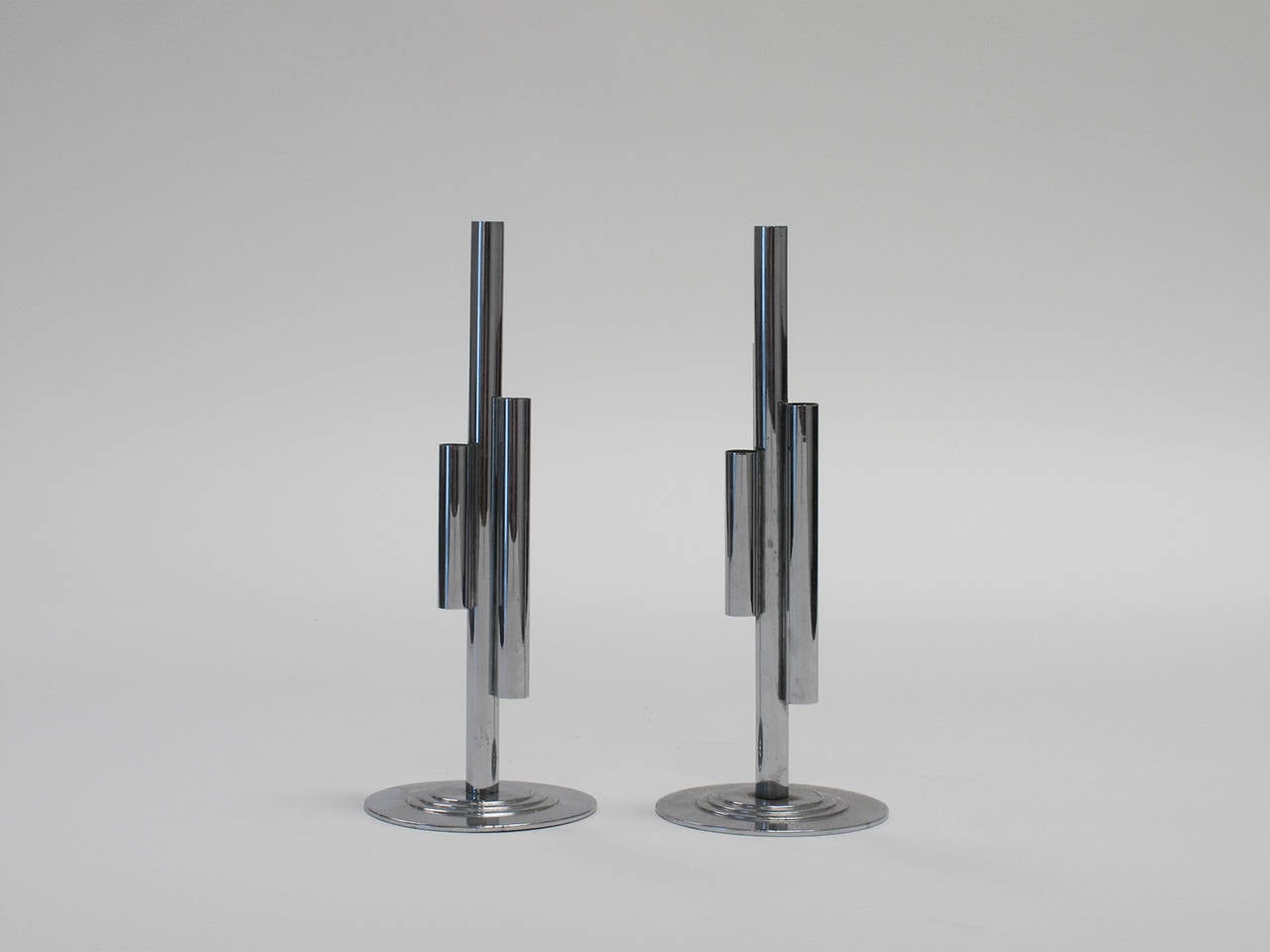 Companion pair of tubular chrome-plated Art Deco inspired bud vases by Chase, 1940s.