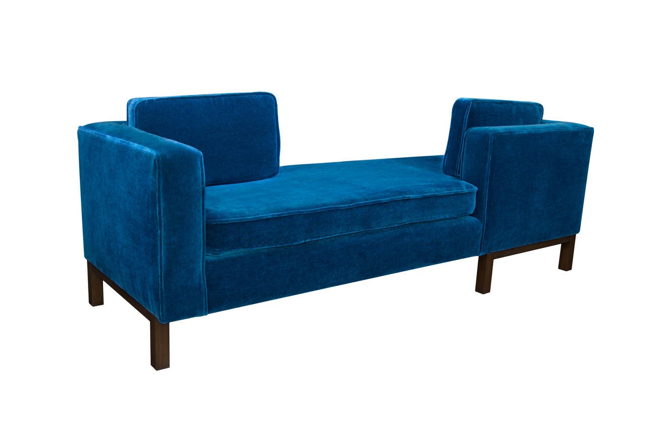 Chic, masculine, Tete-a-Tete sofa attributed to Harvey Probber, early 1970s. Newly re-finished walnut frame and newly upholstered in Lapis Mohair.