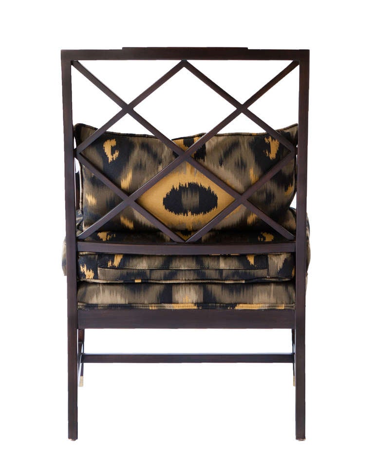 Neoclassical occasional chair by Baker, circa 1990s. Newly upholstered in elegant Bergamo ikat print fabric with brass detailing.