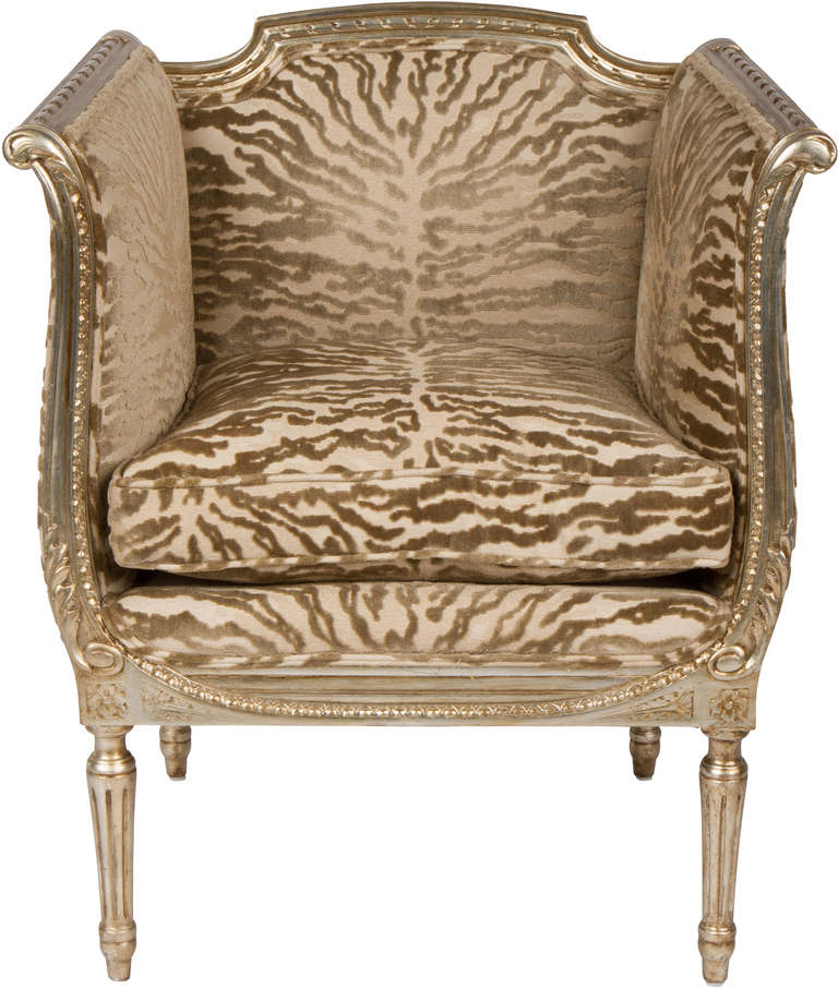 Pair of 19th century French Louis XVI style chairs, newly reupholstered in a fabulous zebra print. The traditional frame features venetian silver leaf over wood. S. Harris cut velvet fabric. Excellent vintage condition.