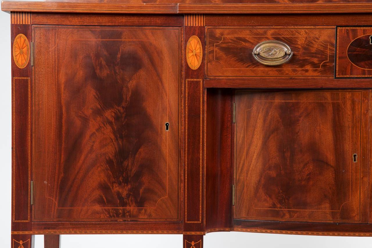 This is an exquisite reproduction antique sideboard by the Potthast Brothers furniture firm, established in the mid 19th century and renowned for their exceptional quality and benchmade construction.  This is a very fine example, quite angular with