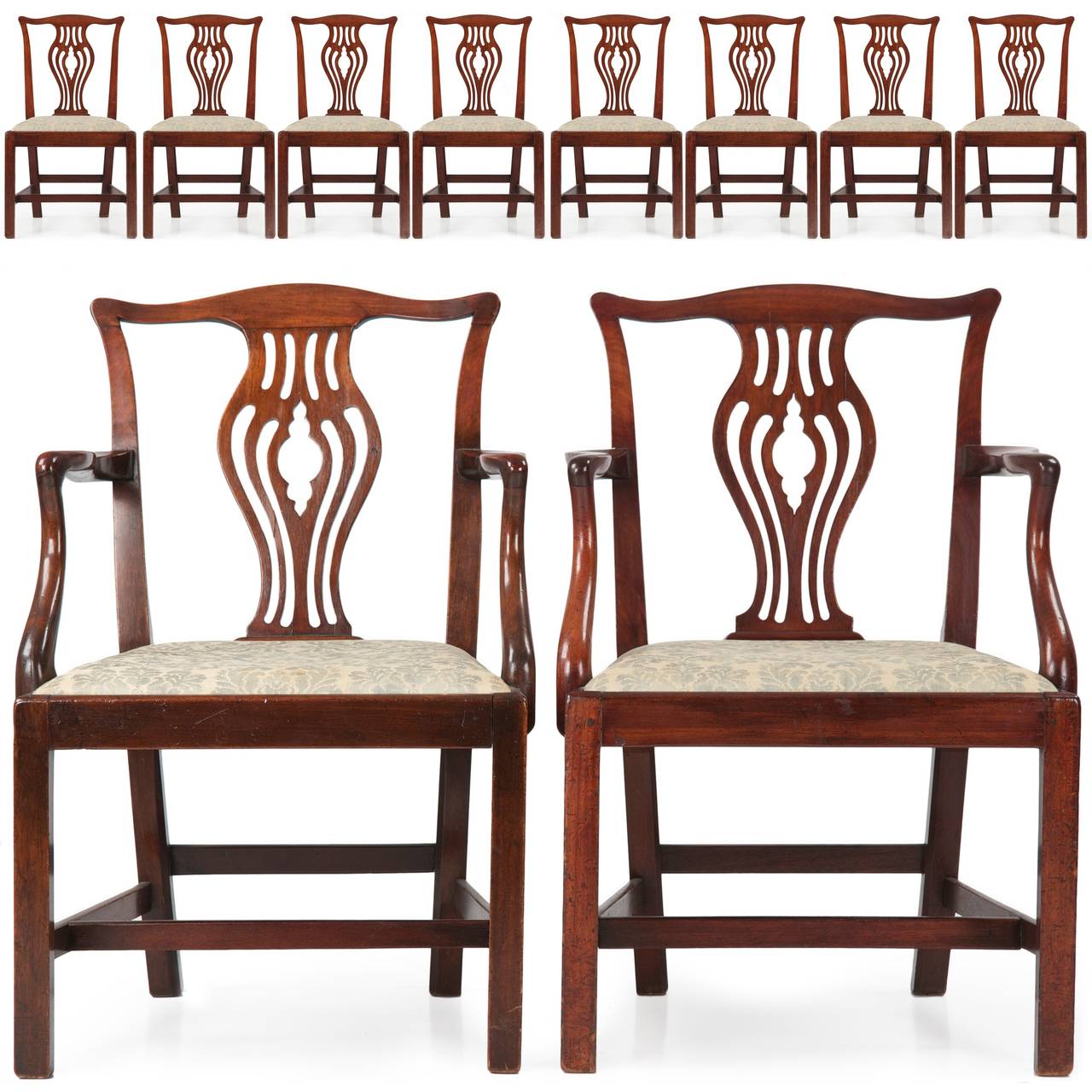 This is an exceedingly attractive set of ten English George III dining chairs, remaining a full pure set with two arm chairs and eight side chairs, all in outstanding condition.  With deeply patinated surfaces and many layers of wax over an early