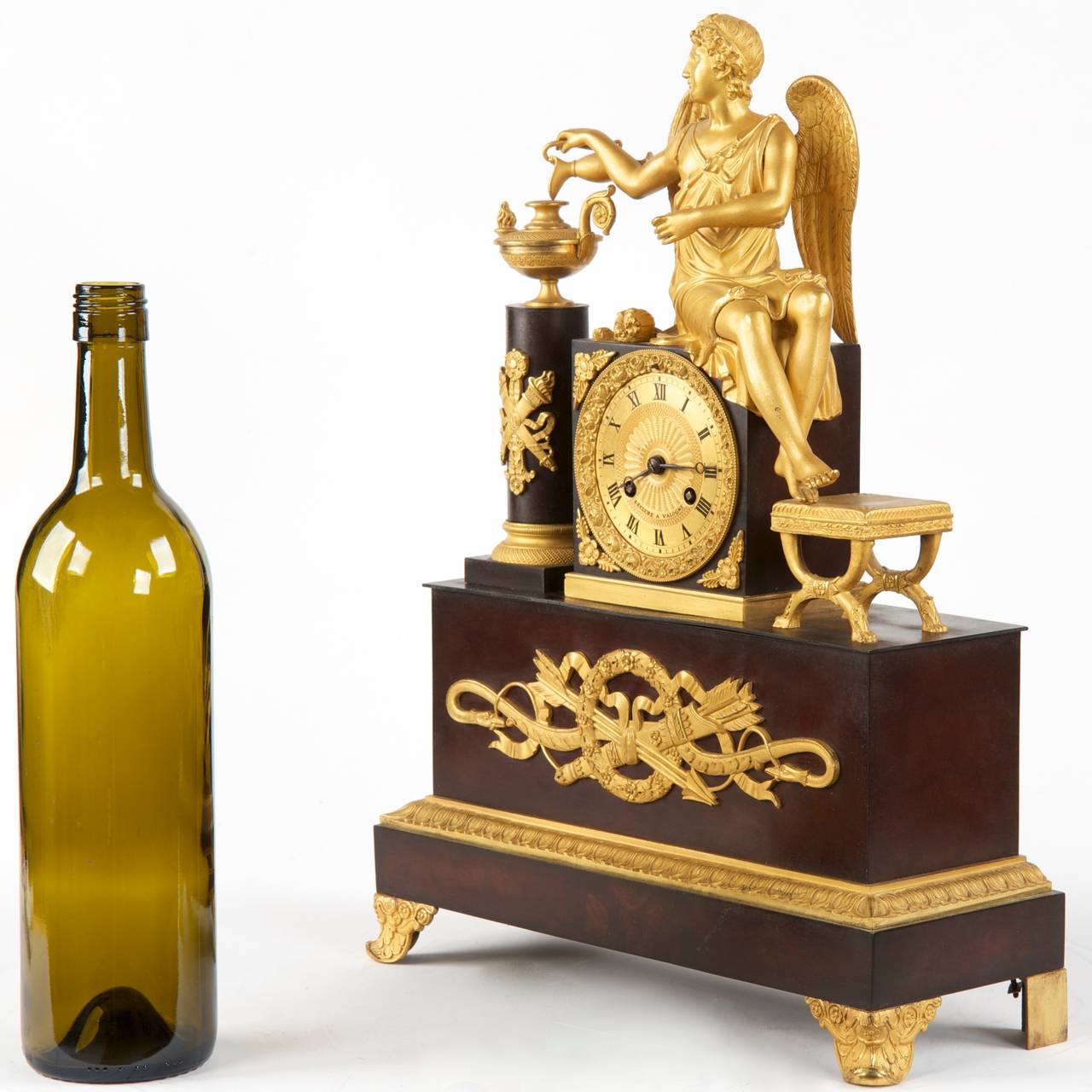 FRENCH GILT AND PATINATED BRONZE WINGED FIGURAL MANTEL CLOCK
Third Quarter of the 19th Century
Item #  502BNP20Q

An exceedingly fine work from the Second Empire, this Napoleon III Period mantel clock features a winged figural in a flowing garb