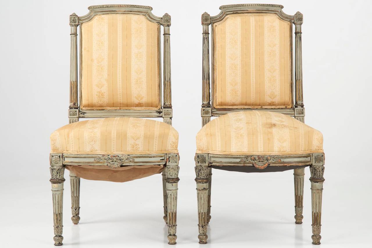 FINE PAIR OF LOUIS XVI STYLE PAINTED ANTIQUE SIDE CHAIRS
France, Third Quarter of the 19th Century
Item #  502ZYL20P 

Crafted during the later portion of the 19th century, probably around 1860-80, these crisply detailed and carved chairs