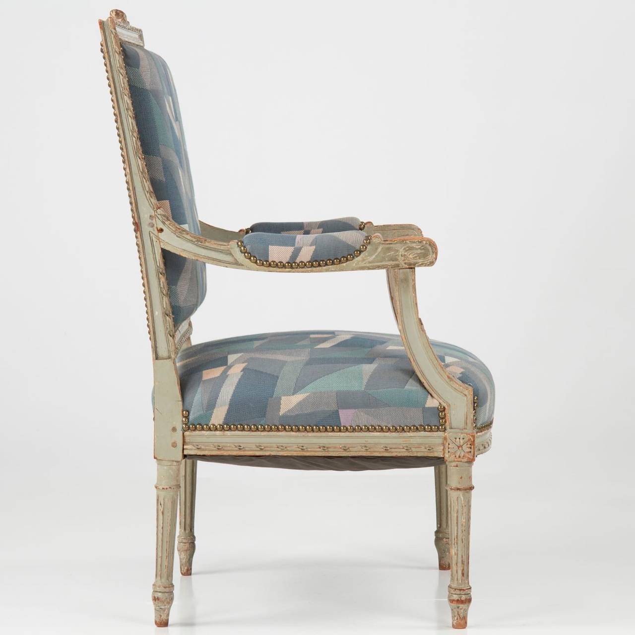 FRENCH LOUIS XVI STYLE GRAY PAINTED ANTIQUE FAUTEUIL ARM CHAIR
19th Century with wonderful early surface
Item #  503FXY22

This is a delightful early to mid 19th Century antique arm chair in the Louis XVI taste, carved in a provincial manner