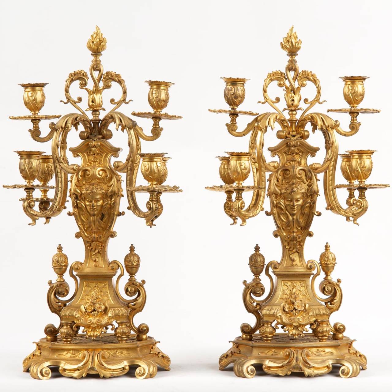 An exceedingly fine pair of perfectly cast, chased and filed gilt bronze candelabra, they were crafted during the last quarter of the 19th century. Each featuring six candle wells, they are embellished with a very tasteful and precise level of