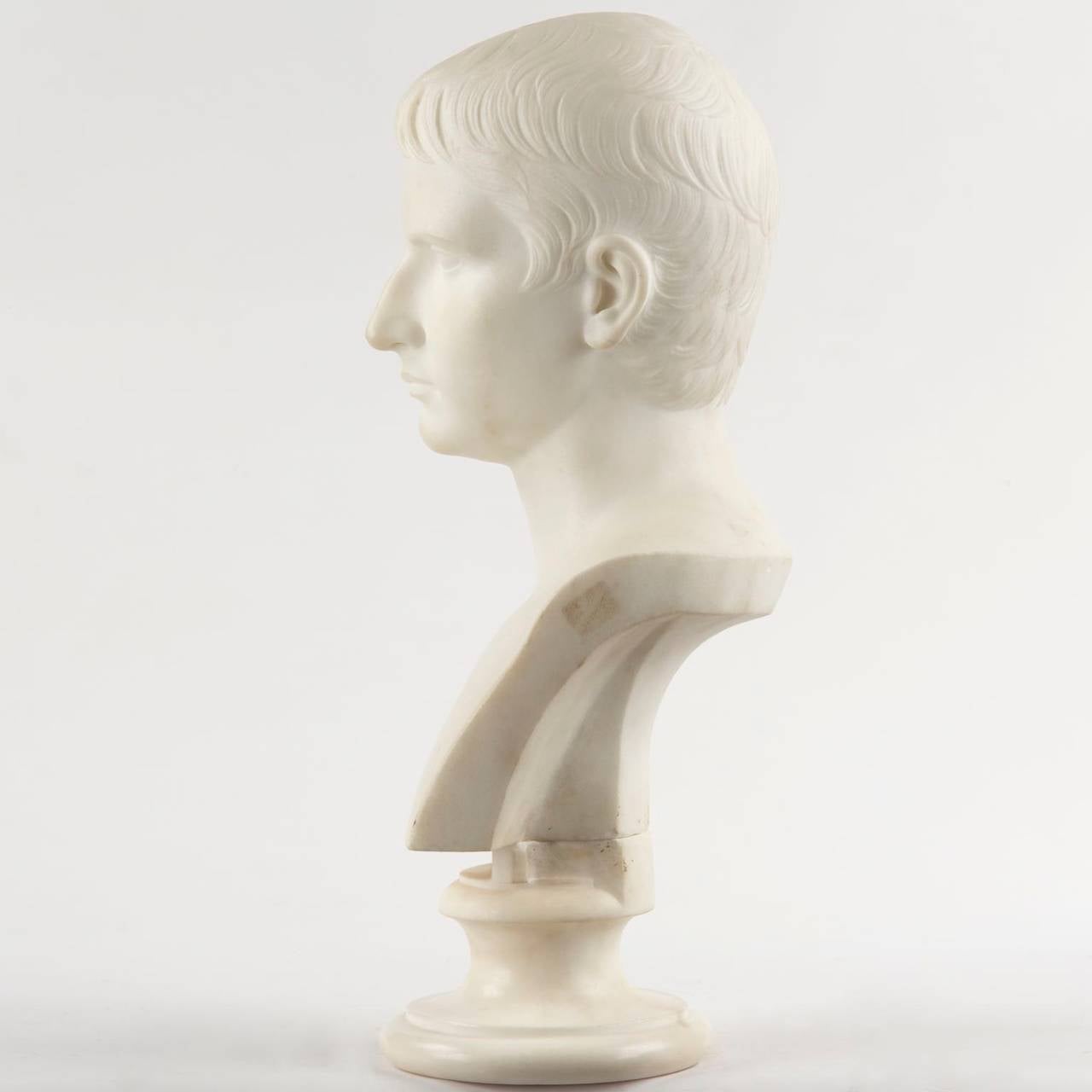 A fine and striking marble sculpture, this bust is thought to capture the pose of a young Caesar Augustus. It is crisply executed, the hand carving finished quite beautifully on a finely selected block of marble with it's pure white surface. The