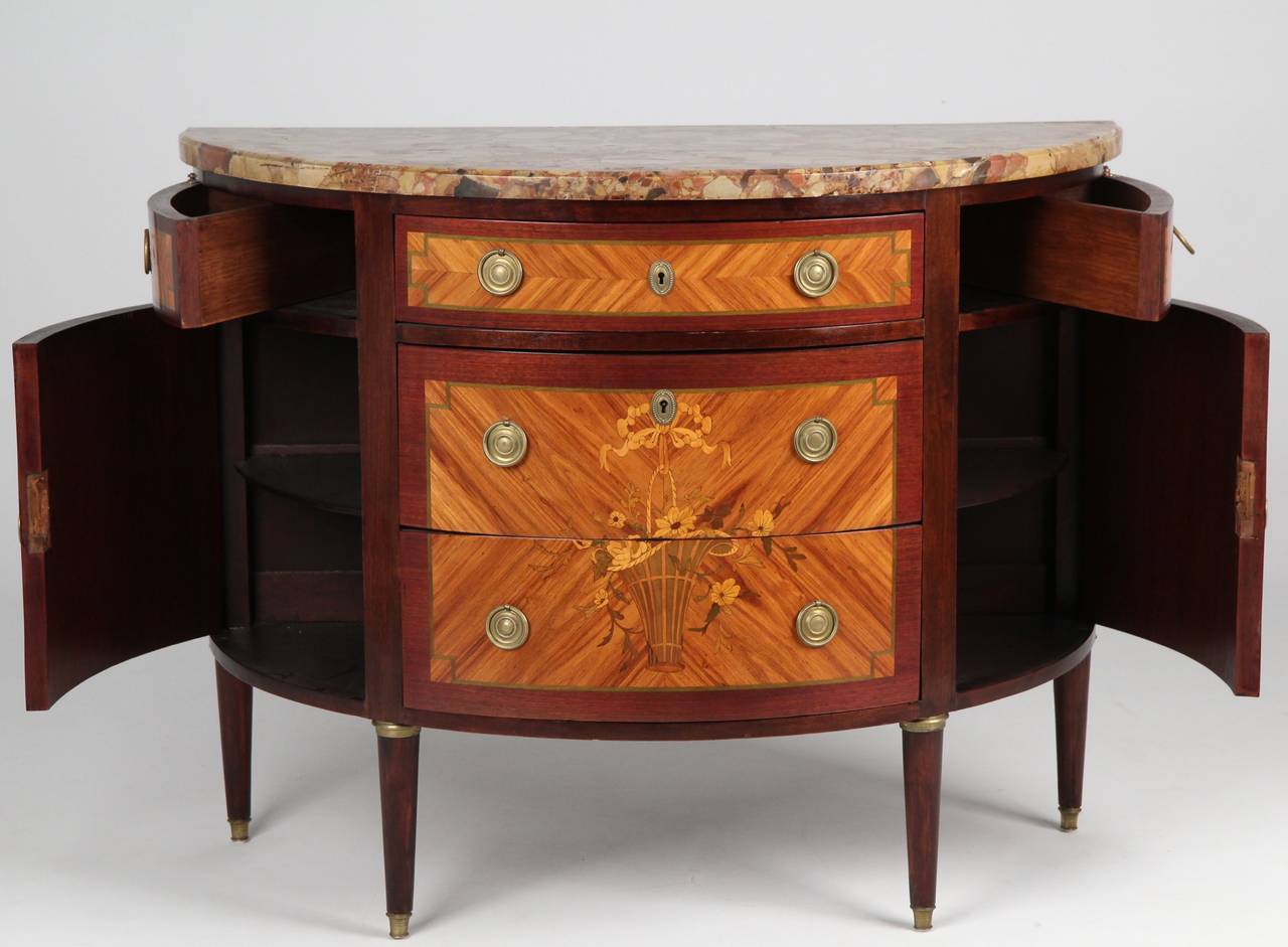 Simply gorgeous and nicely preserved, this very attractive French Louis XVI Style Antique Commode is simply above reproach. At least a century after being crafted entirely by hand, the commode remains in nearly identical condition to when it left