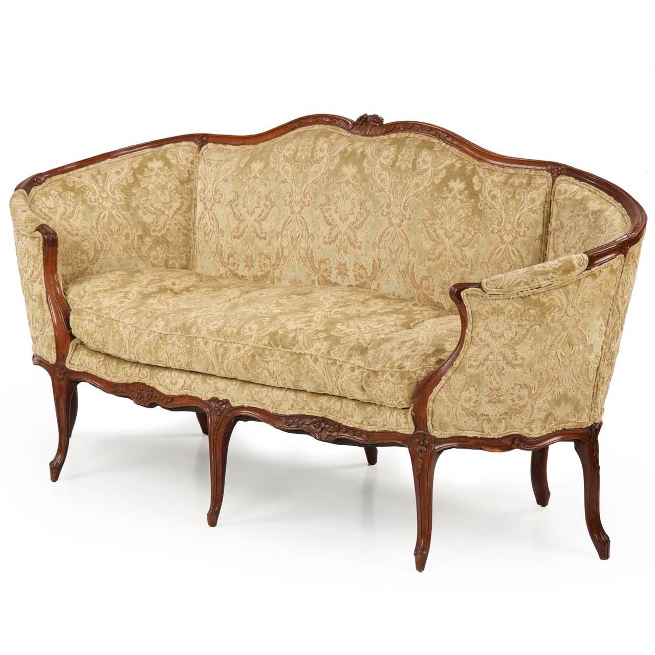 An exceedingly fine work clearly executed by a talented hand, this Louis XV period canapé is designed with excellent proportions and overall form.  The arms wrapping around the seat on either side, the settee has a warm presence intended for