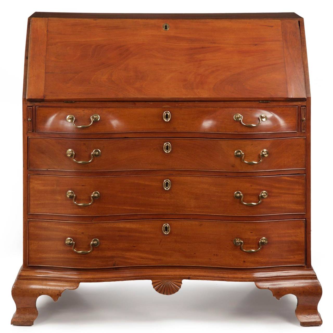 A very fine work of the Chippendale period, this desk was an expensive and very time consuming piece to produce. The oxbow drawers are a work of art, wrought from very thick solid mahogany planks that were then hand sawn and carved extensively to