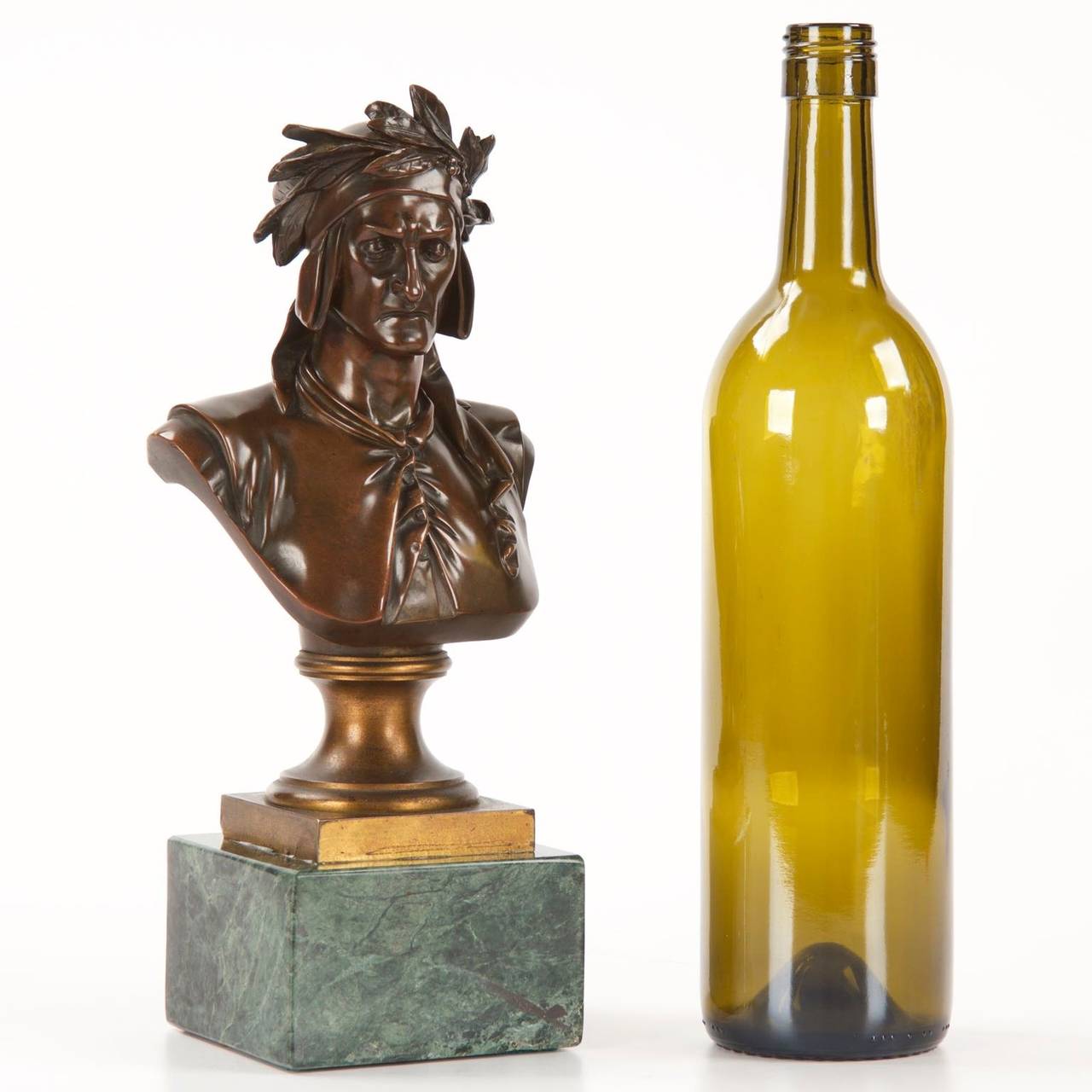 A finely cast work originally retailed by Tiffany & Co, stamped in their typical manner along the verso of the doré plinth, the bust captures a solemn Dante Alighieri in his familiar laurel crown.  The carefully chased and filed surface is a nearly