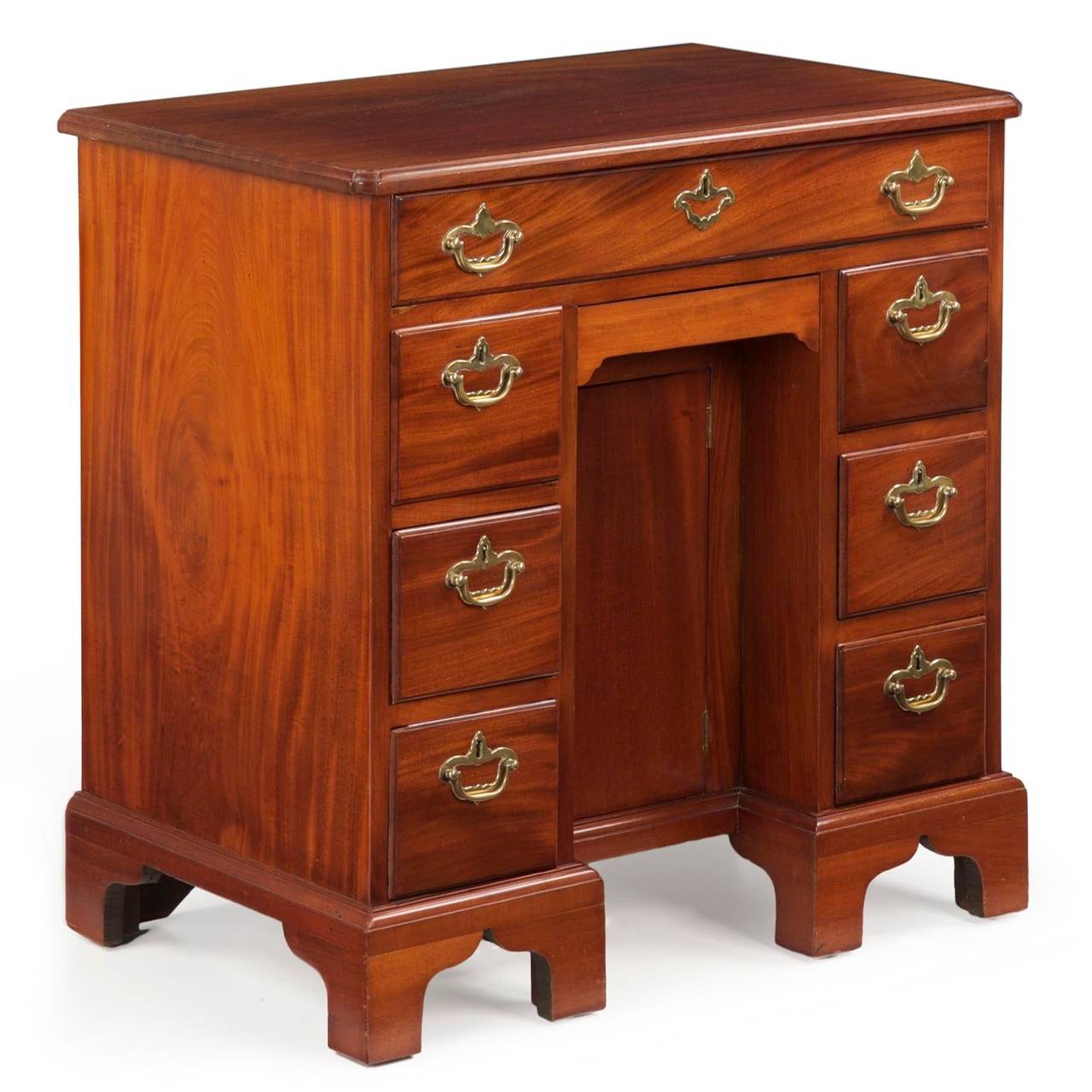 Crafted of well figured solid single boards of mahogany on the top and sides, this finely executed dressing table is intended as a statement piece for a fine Georgian bedroom.  A simply molded edge is routed into the perimeter of the top, each inset